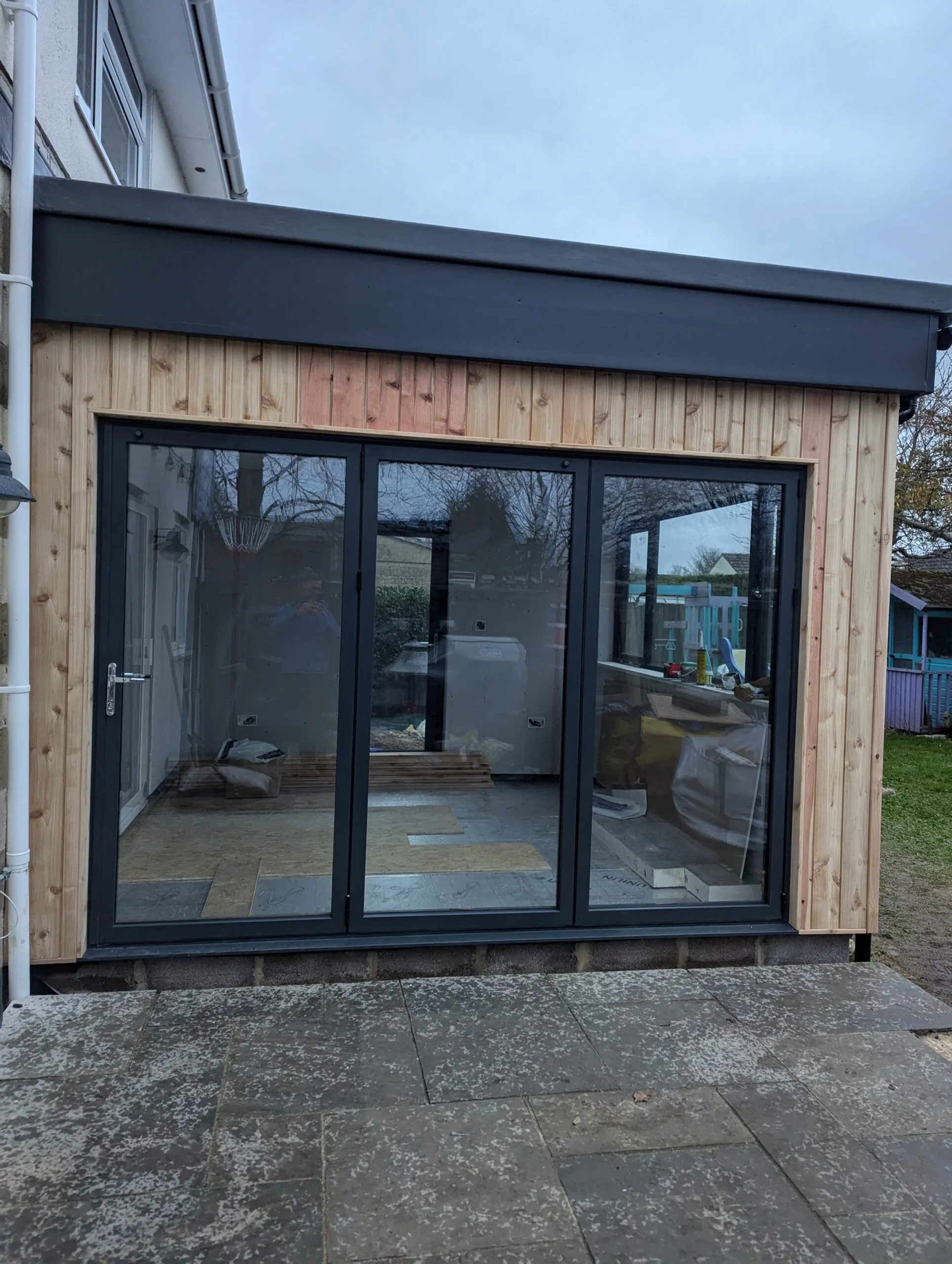 Custom-built garden room with sliding doors – insulated outdoor building designed and constructed by N. Patten.